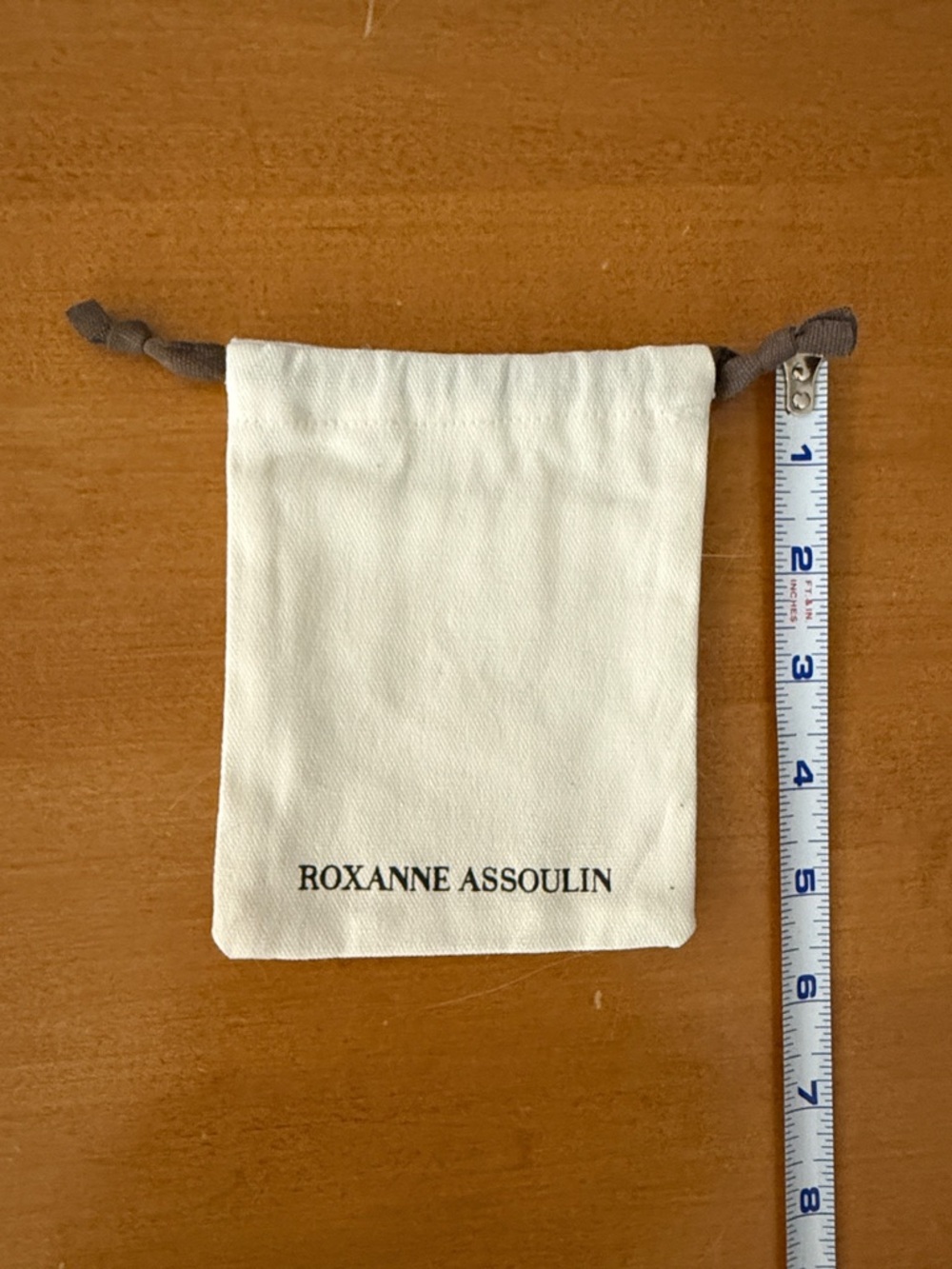 Roxanne Assoulin Cream thick canvas dust bag with Gray Drawstrings